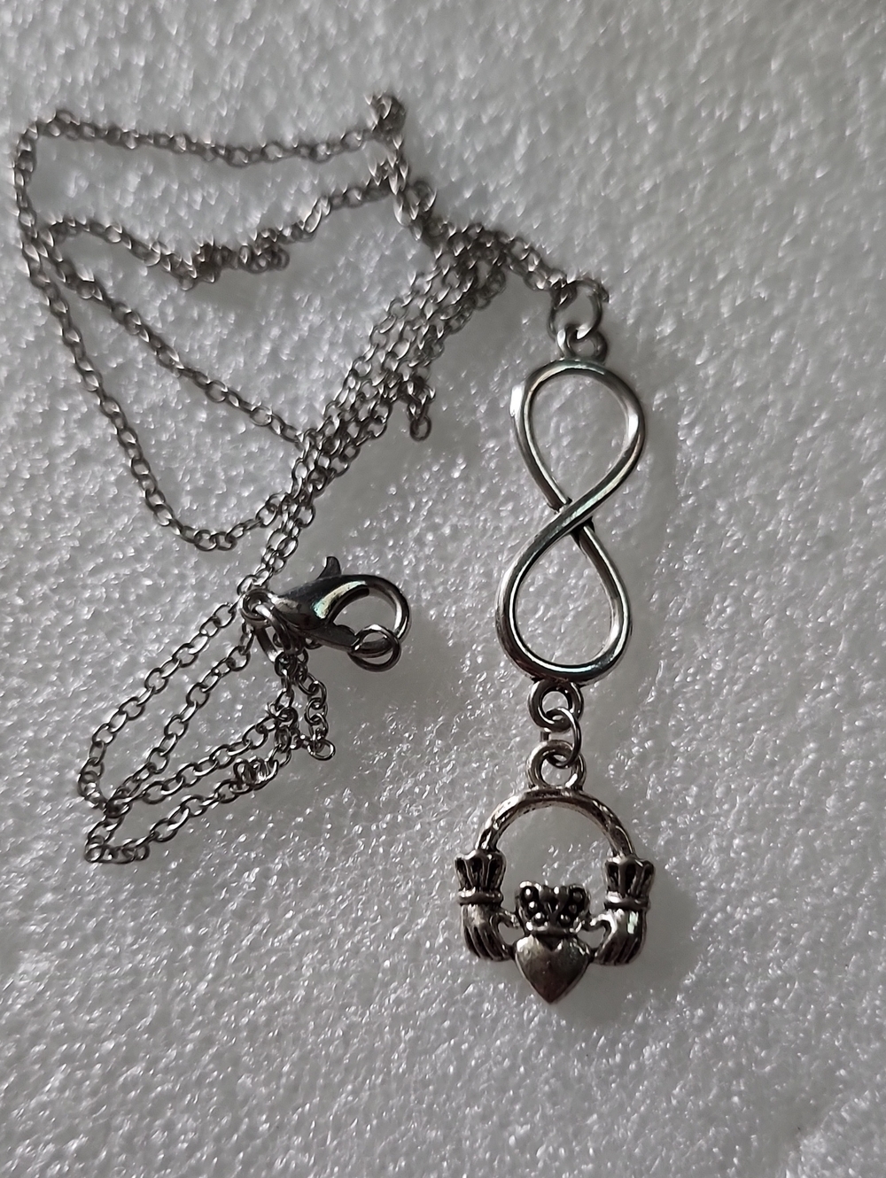Hand Crafted Silver Infinity Necklace with Claddagh Charm